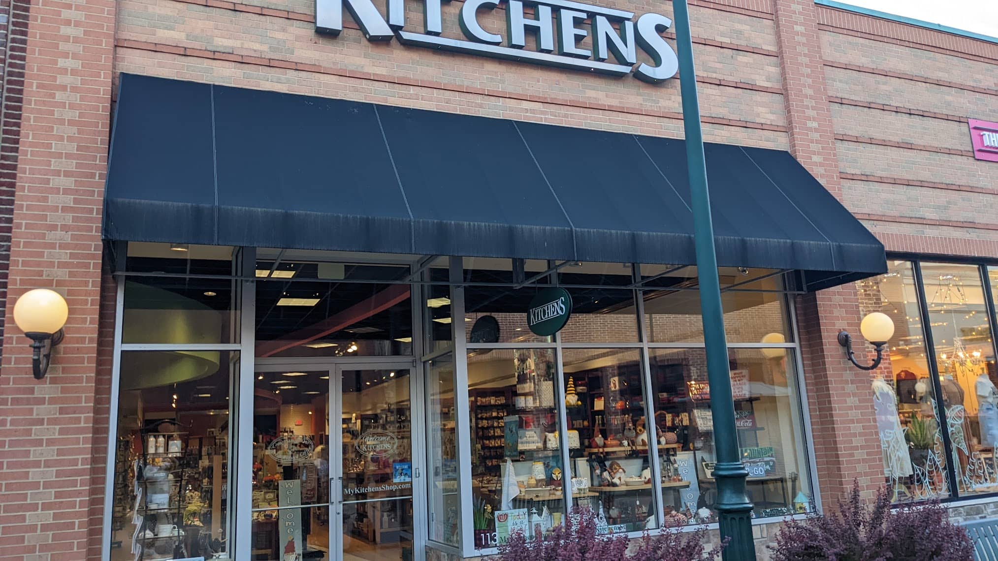 Kitchens storefront entrance and window display in a daytime shopping district, a long-standing Scott Labz retail client