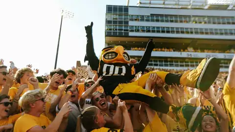 Herky the Hawk mascot crowd-surfing over the student section